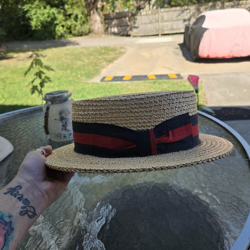 Stylish Straw Boater Hat with Red and Black Ribbon